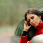 nauseas woman in a car