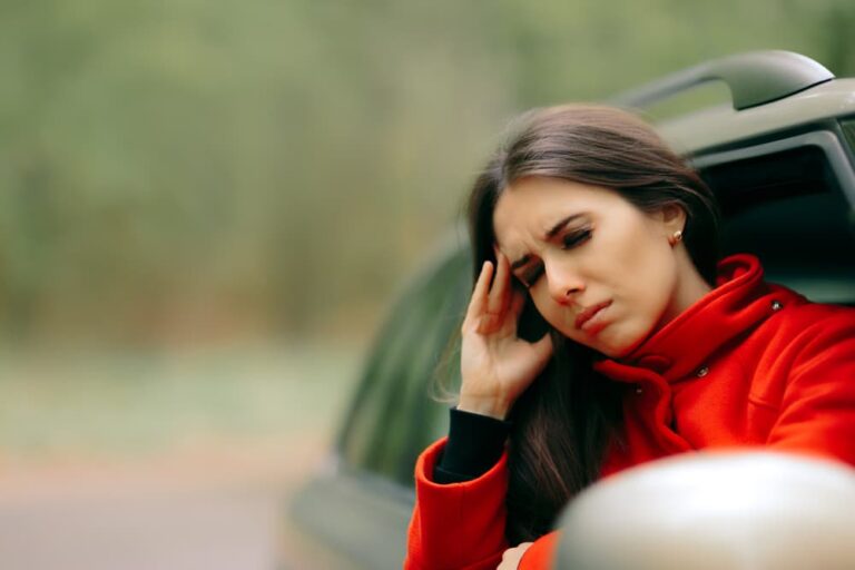 nauseas woman in a car